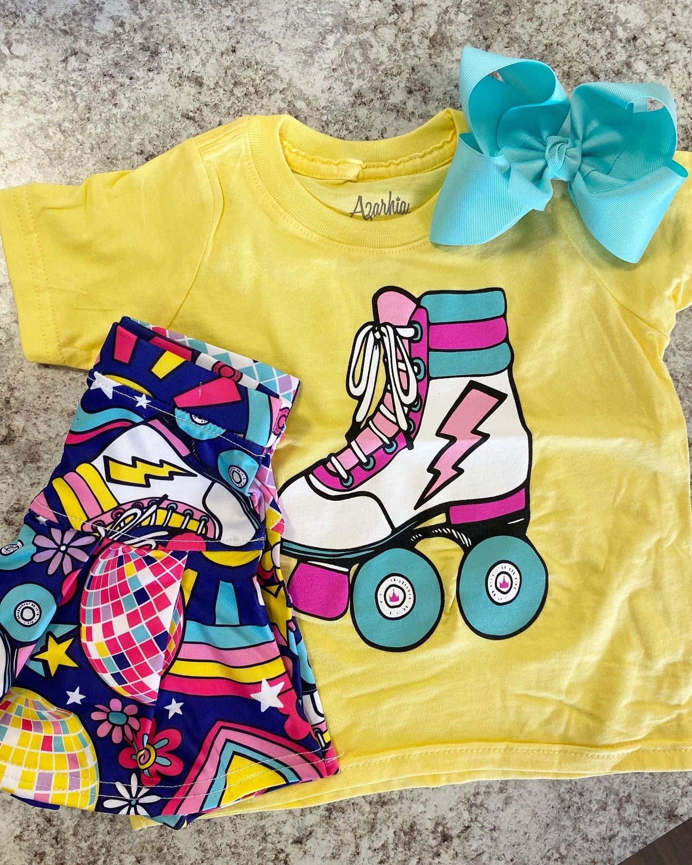 T Shirt - Butter with Disco Roller Skate